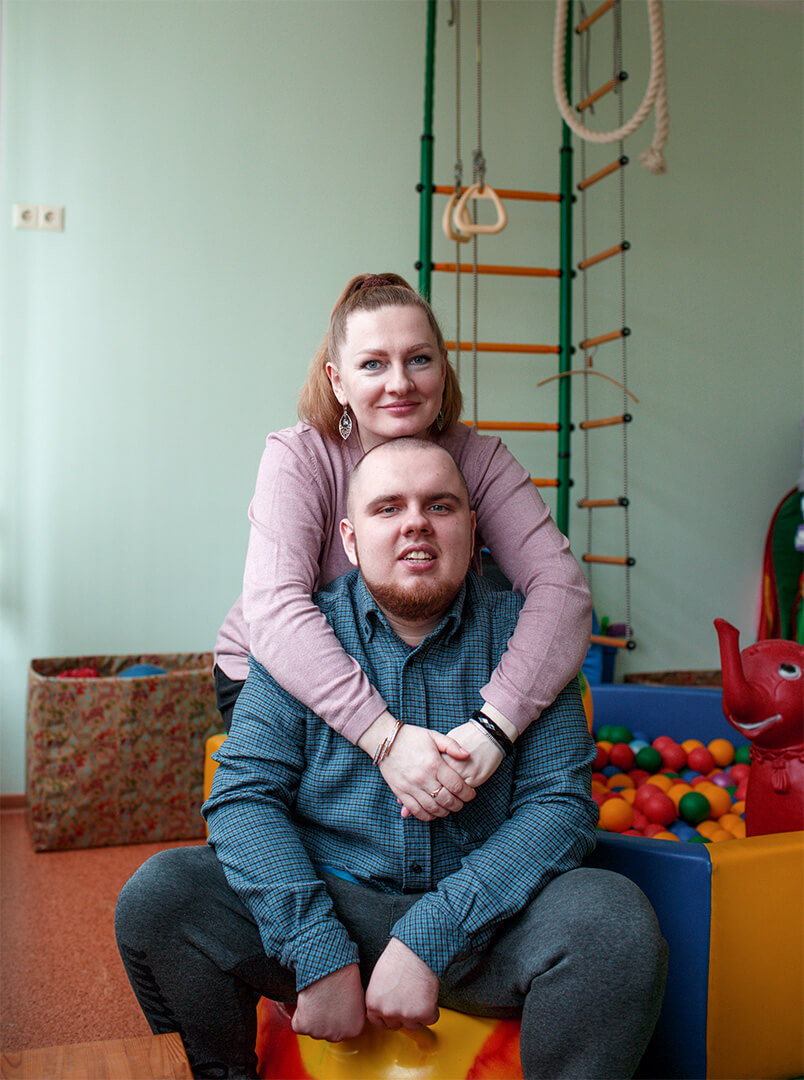 Mom hugs adult son with Autism