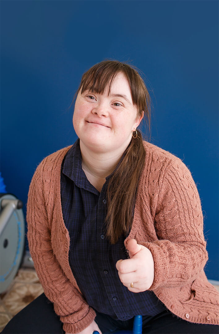 women with down syndrome gives thumbs up