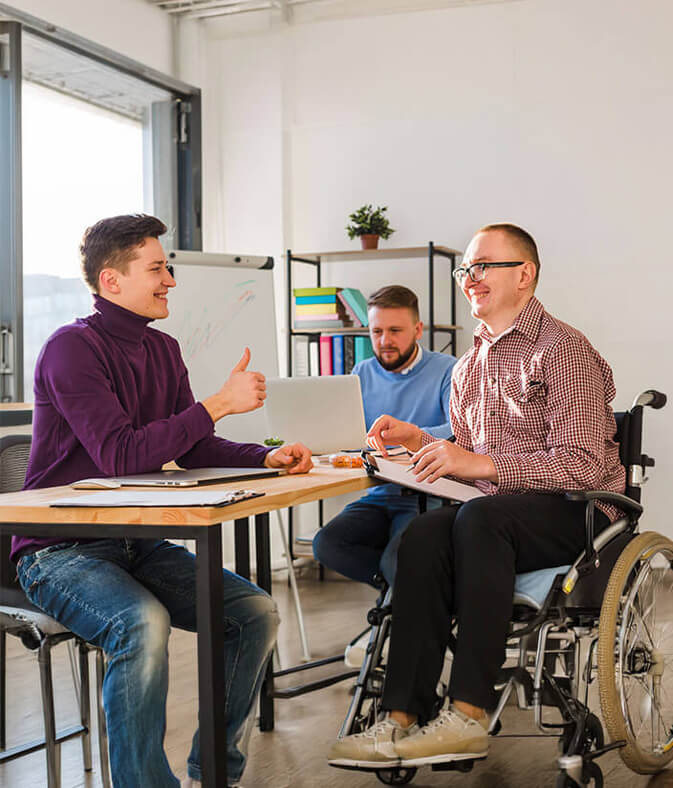 Man in a wheelchair in an office